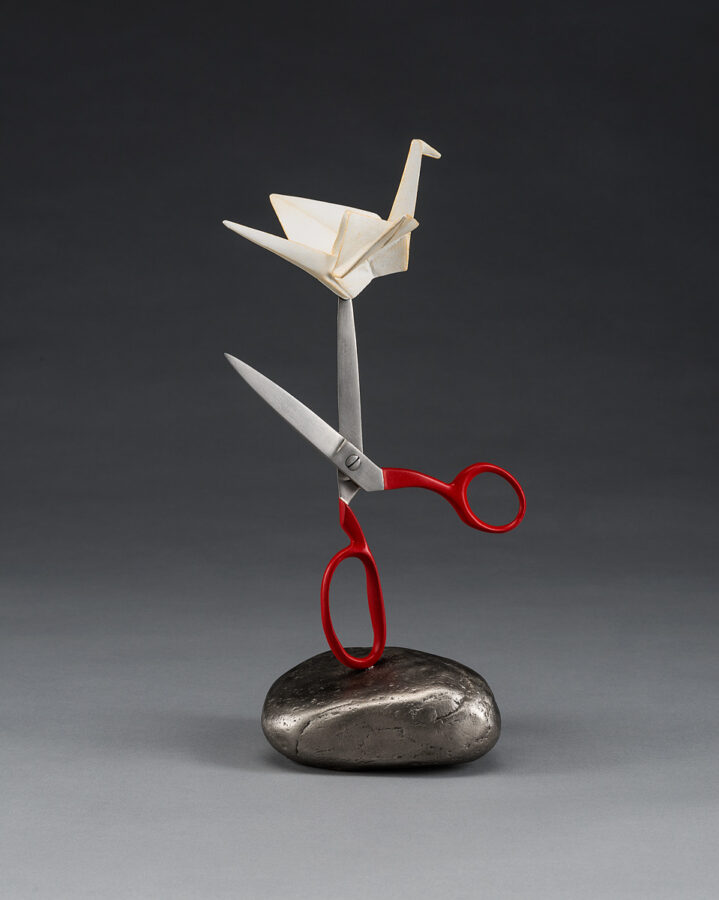 crane scissor and rock sculpture