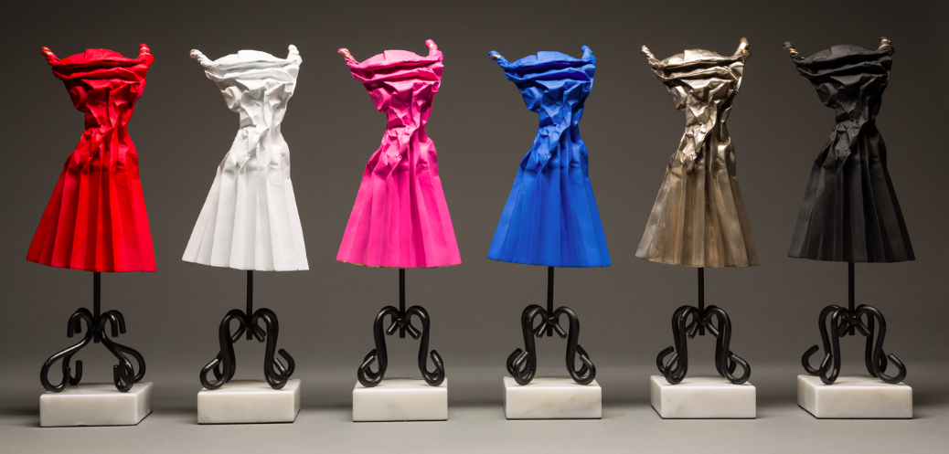 small dress sculptures in various colors