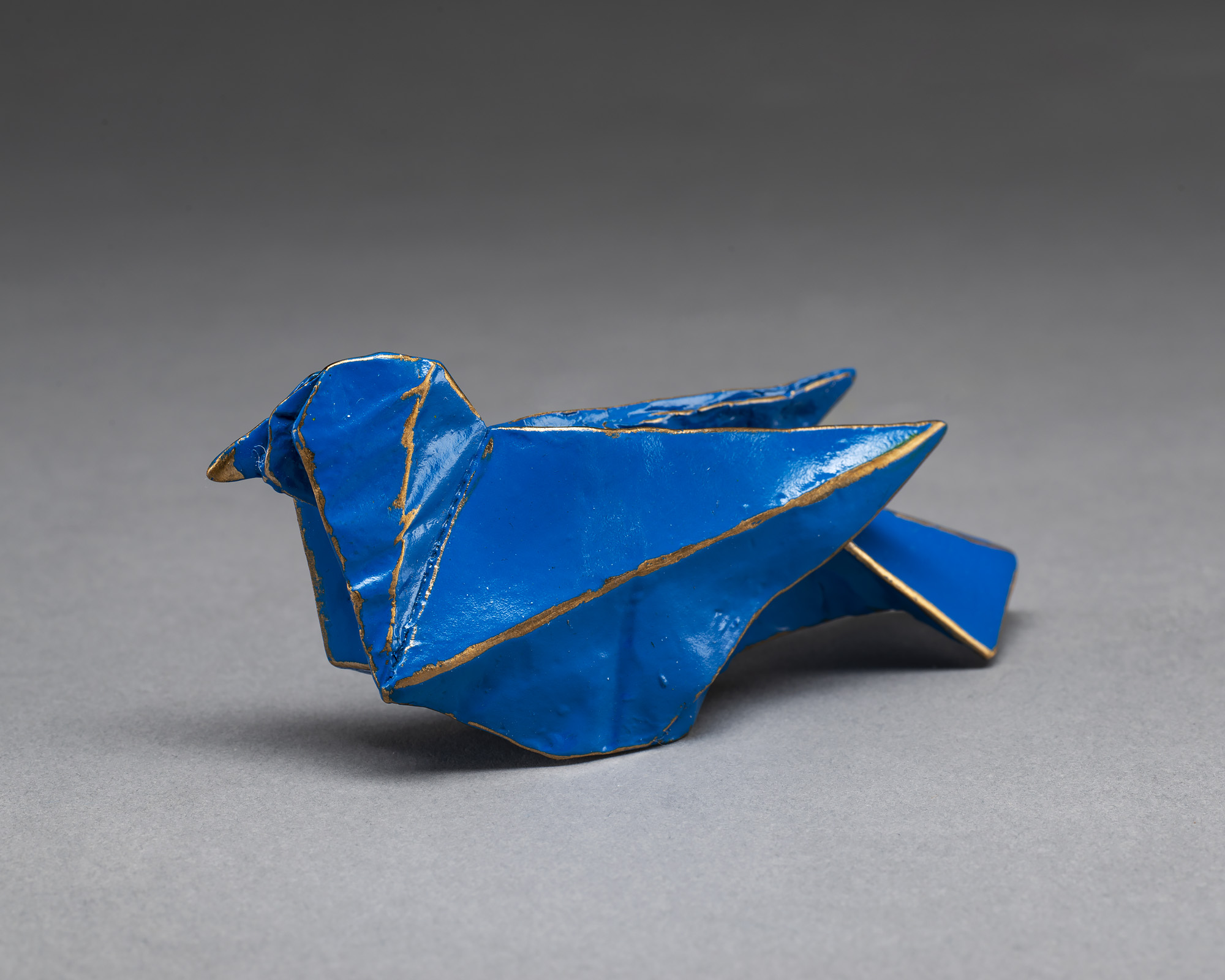 blue origami bird sculpture