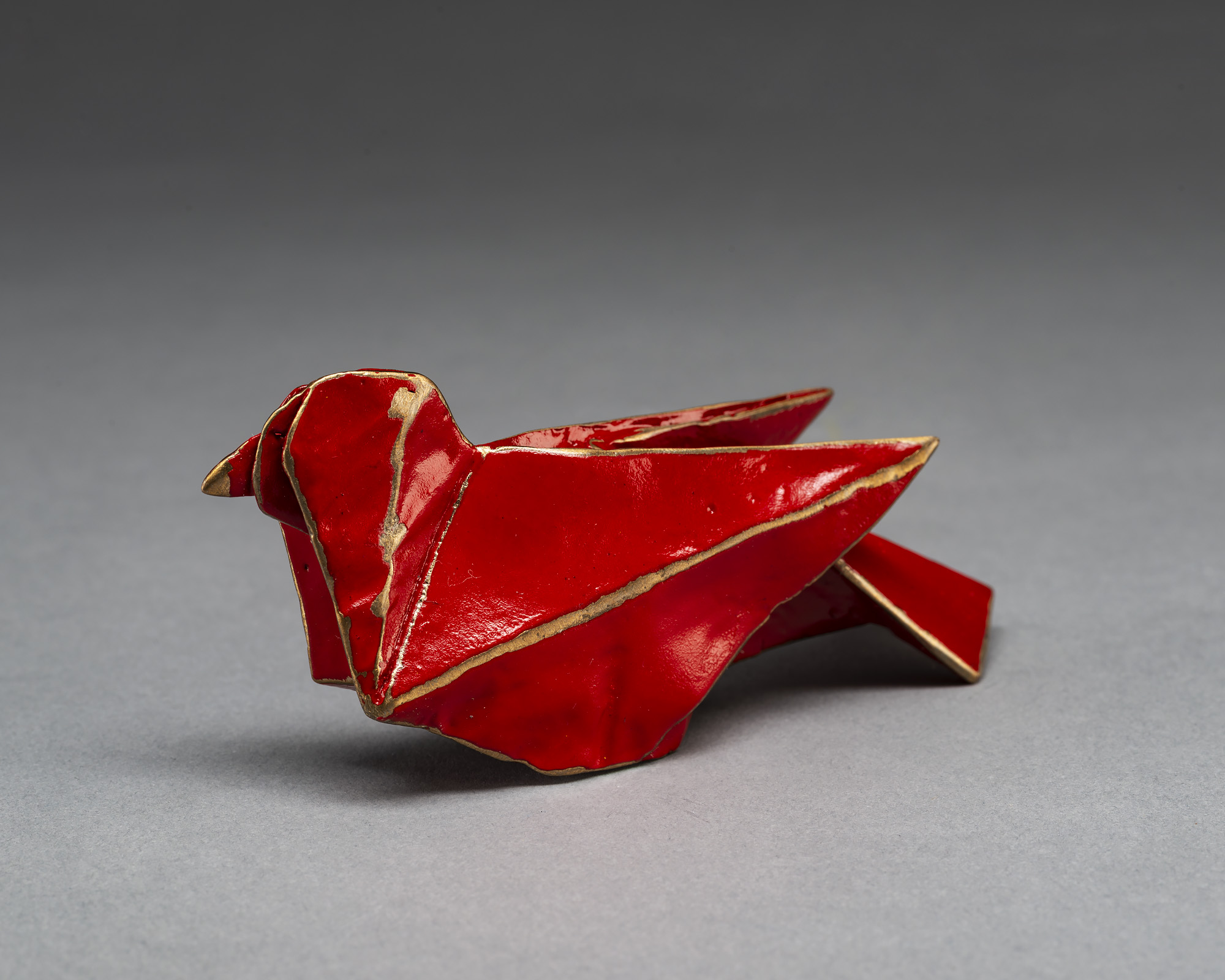 red origami bird sculpture